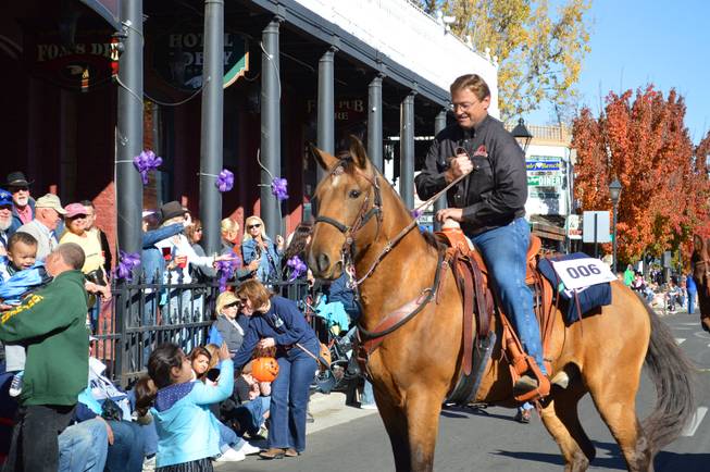 U.S. Sen. Dean Heller, R-Nev., reins in his horse during the Nevada Day parade in Carson City on Saturday, Oct. 26, 2013.